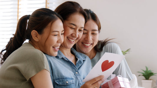Asian mom celebrating Mother’s Day with two grown up daughters